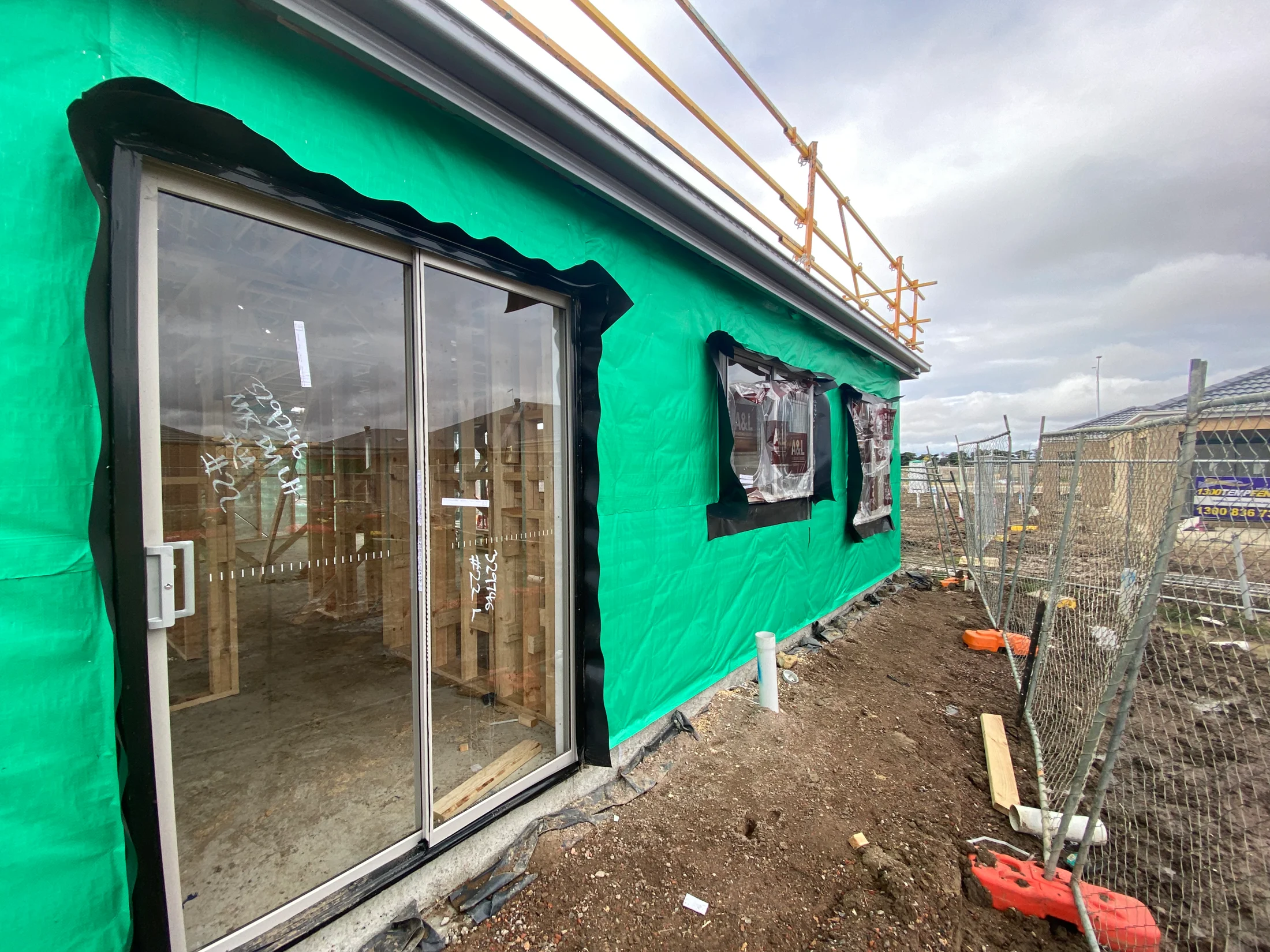 A house just after frame stage showing aluminium windows with compliant flashings installed