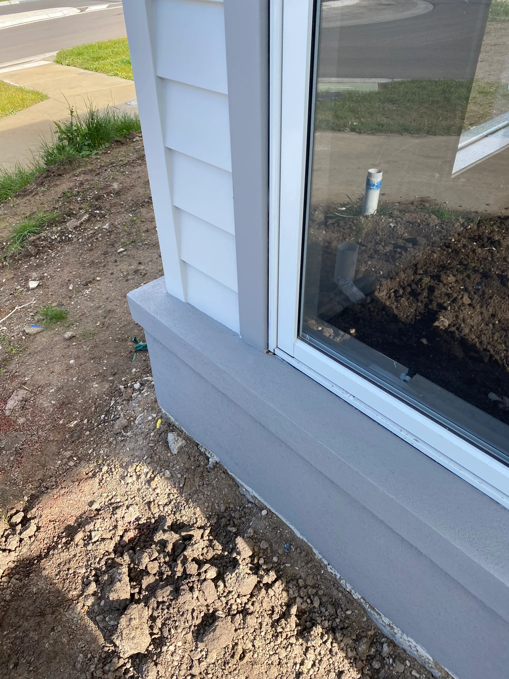 A picture of the corner flashing and rubber seal installed