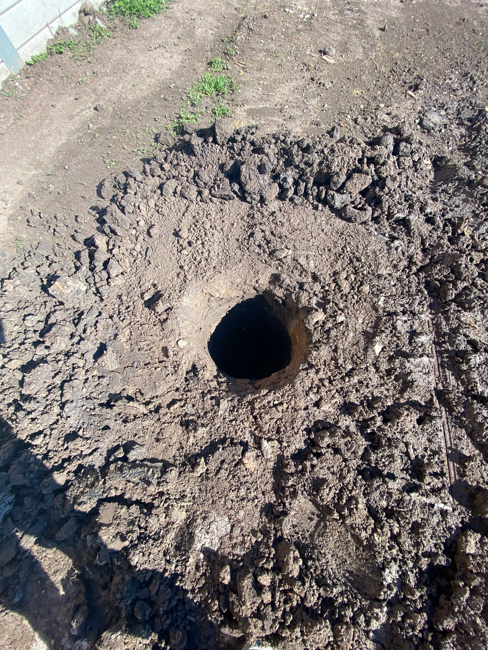 A bored pier hole, ready for concrete