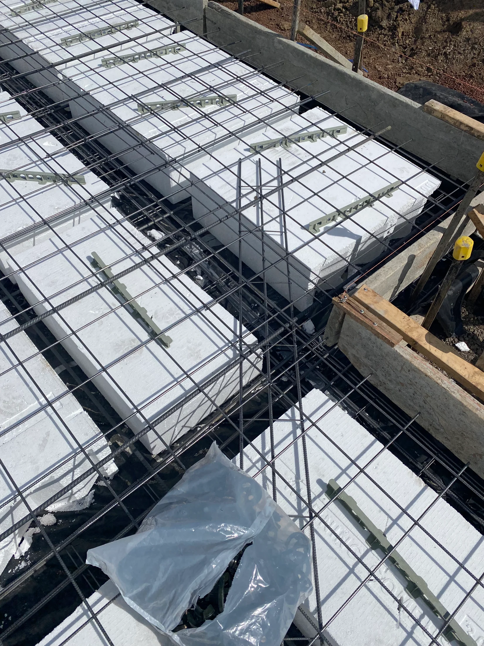 Slab stage pre pour with waffle pods and reinforcement installed